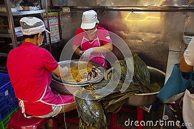 Taiwan, Taipei, Dragon Boat Festival, South Gate Market, making meat dumplings Editorial Stock Photo