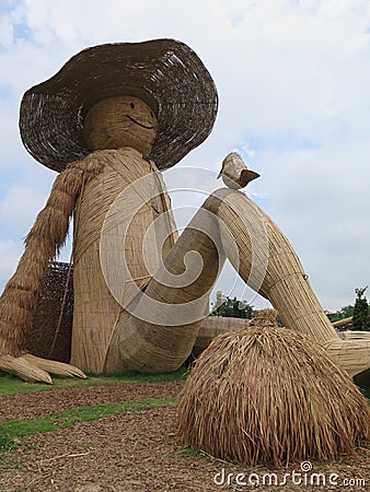 Scarecrow resting after farming Stock Photo