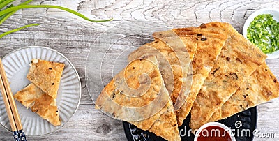 Taiwanese delicious scallion pancake over wooden table background Stock Photo