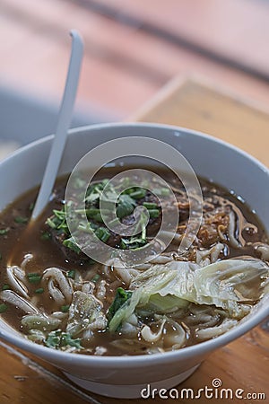 Taiwanese food of soup noodles with pork ribs cakes at restaurant Stock Photo