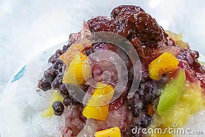 Taiwanese mixed fruit shaved Ice snowflake smoothie at night market in Kaohsiung, Taiwan. Stock Photo