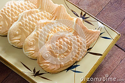 Taiyaki cakes on wood background,Japanese confectionery Stock Photo