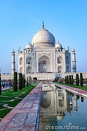 Taj Mahal in India with reflection in pond and with the inscription of the coran in arabic letter meaning in english: This is an Stock Photo