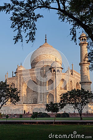 Taj Mahal in morning light with the inscription of the coran in arabic letter meaning in english: This is an invitation to live on Stock Photo