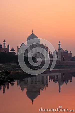 Taj Mahal reflected in Yamuna river at sunset in Agra, India Stock Photo