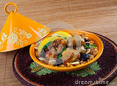 Tajine, Moroccan food, with cous cous, chicken and lemon confit Stock Photo