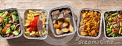 Take away healthy food in foil boxes Stock Photo