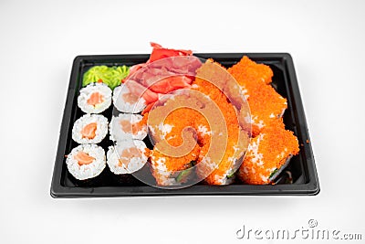 Take away sushi rolls in plastic container, california, salmon maki roll, pink ginger, wasabi. sushi delivery concept Stock Photo