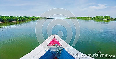 take a boat across the river towards the desired destination Stock Photo