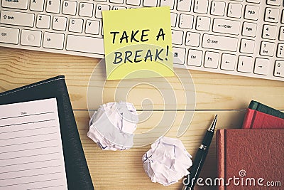 Take a break text on yellow paper Stock Photo