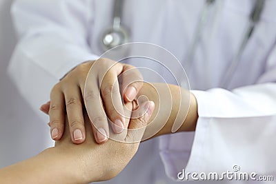 Take care and trust concept, Doctor holding hands of patient at hospital Stock Photo