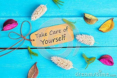 Take care of yourself text on paper tag Stock Photo