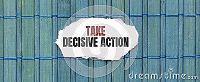 TAKE DECISIVE ACTION text on the piece of paper on the green wood background Stock Photo