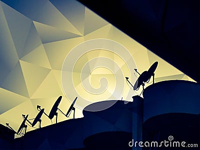 cubist style coloured triangulation sky abstract design from rooftop satellite dishes Stock Photo