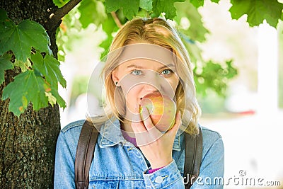 Take minute to relax. Break for snack. Student eat apple fruit nature background defocused. Healthy snack. Girl student Stock Photo