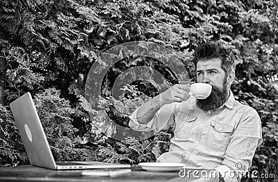 Take moment to enjoy life. Guy drinks coffee relaxing terrace branches background. Aroma cappuccino. Pleasant moment Stock Photo