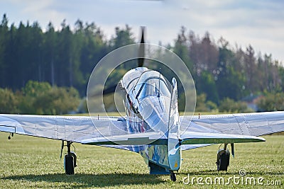 Take off from grass airfield of Ultralight replica of soviet fighter plane Yakovlev Yak 3. Stock Photo