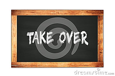 TAKE OVER text written on wooden frame school blackboard Stock Photo