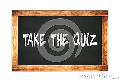 TAKE THE QUIZ text written on wooden frame school blackboard Stock Photo