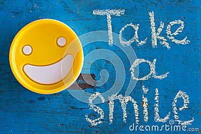 Take a smile. Motivational inscription. Stock Photo