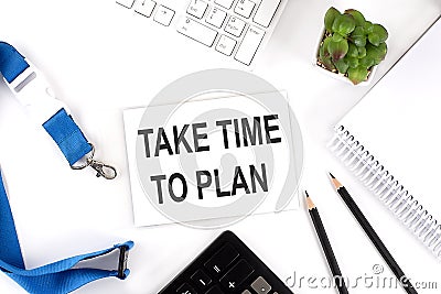 TAKE TIME TO PLAN Words on the card with keyboard and office tools Stock Photo