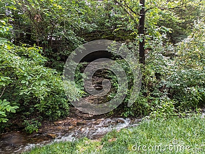 Small Cave and Stream Stock Photo