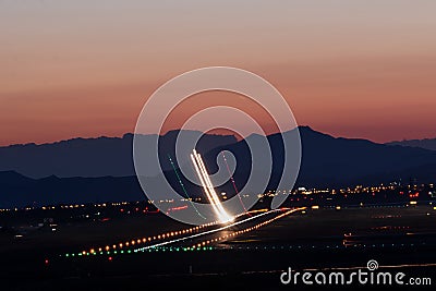 Takeoff at sunset Stock Photo