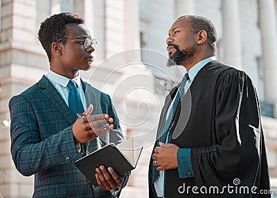 Taking all the important notes. two male lawyers talking in the city. Stock Photo