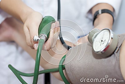 taking an arterial blood pressure Stock Photo