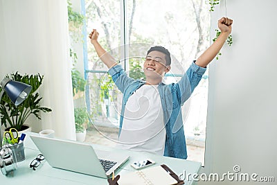 Taking a break from business. Smiling handsome asian businessman Stock Photo