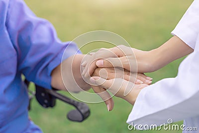 Taking care of the elderly people, nurse comforting patient. Stock Photo