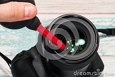Taking care of photographic lens Stock Photo