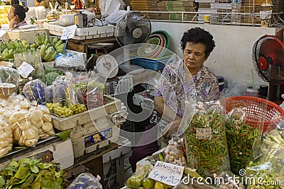 Taking a Nap in the Market Editorial Stock Photo