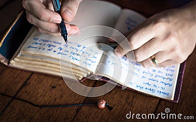 Writing in journal Stock Photo