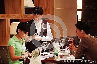 Taking order in a restaurant Editorial Stock Photo
