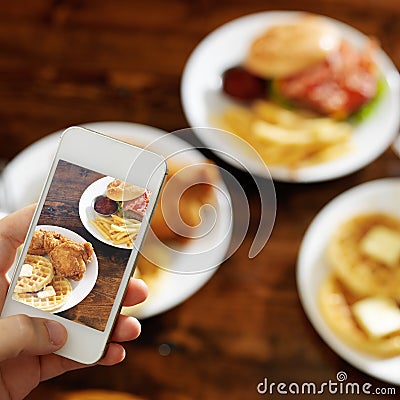 Taking photo of food with smartphone Stock Photo