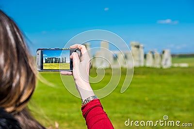 Taking a photo of Stonehenge Stock Photo