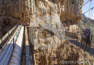 Taking pictures to theirselves over the suspension bridge of the Editorial Stock Photo