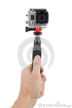 Taking selfie - hand hold monopod with action camera Stock Photo