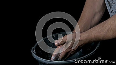 Talc sports. Closeup of a muscular man ready to workout. male powerlifter hand in talc and sports wristbands preparing Stock Photo