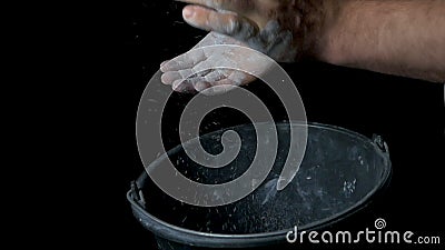 Talc sports. Closeup of a muscular man ready to workout. male powerlifter hand in talc and sports wristbands preparing Stock Photo