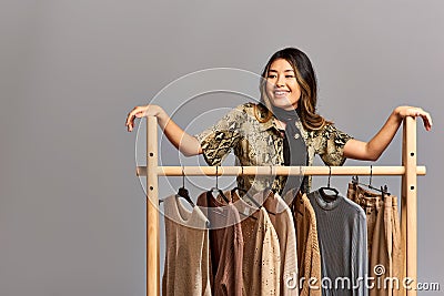 talented delighted asian fashion designer smiling Stock Photo