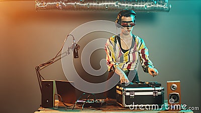 Talented disc jockey using vinyl to mix music at turntables Stock Photo