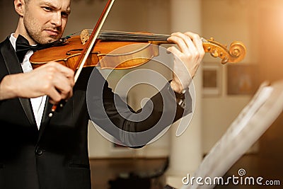 Talented gorgeous man play violin Stock Photo