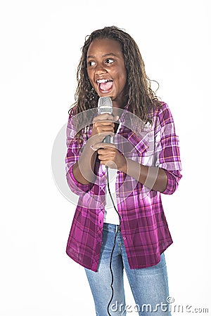 Talented young diverse singer singing into a microphone Stock Photo