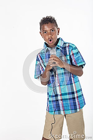 Talented young diverse singer singing into a microphone Stock Photo