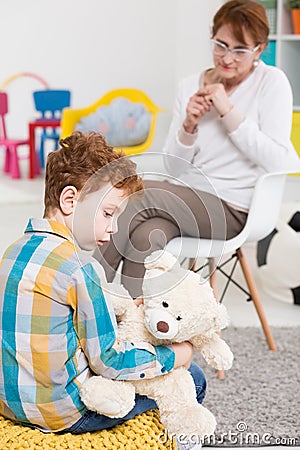 Talk with introverted boy Stock Photo