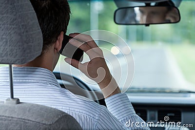 Talking on phone during driving car Stock Photo
