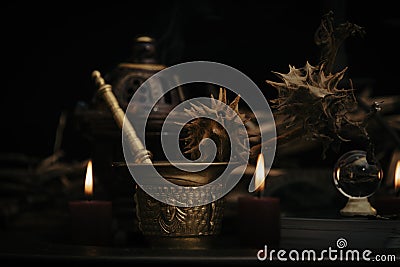 Talking spiritual board with black candles and old key. Wicca, esoteric and occult background with vintage magic objects Stock Photo