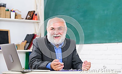 Talking to students or pupils. Senior school teacher concept. Honored professor. Teacher bearded man tell cheerful story Stock Photo